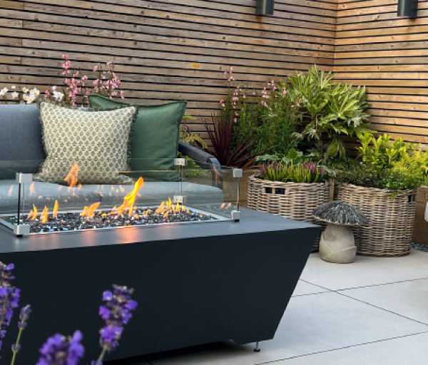 A firepit table on a garden patio