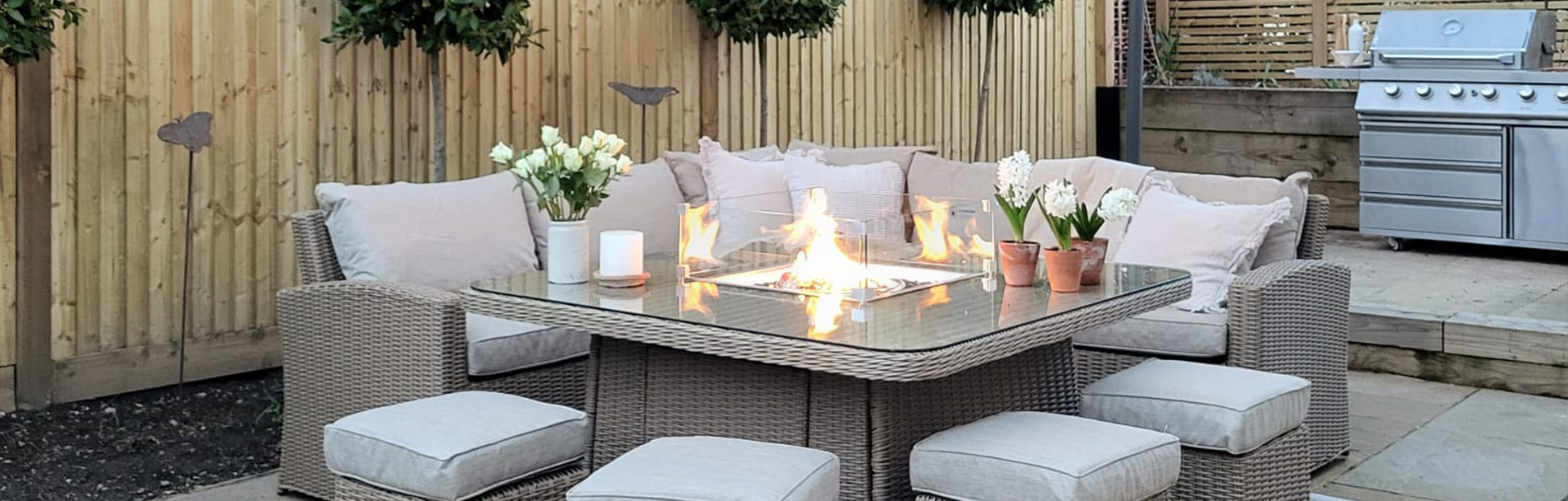 rattan garden corner sofa with a fire pit table