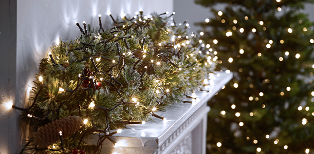 String lights on mantlepiece with garland