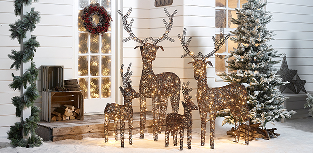 Rattan Christmas Reindeer Family Outside A Home