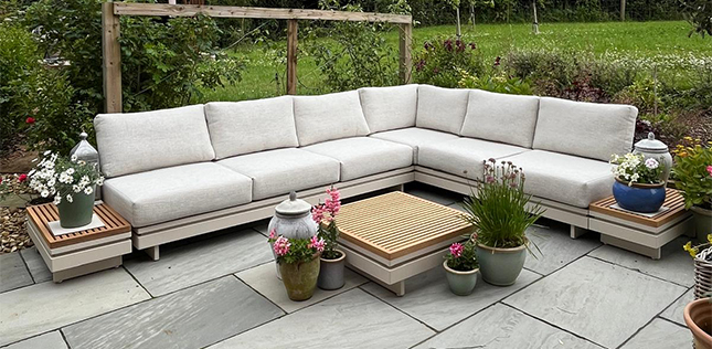 cream garden corner sofa with teak table